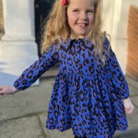 Little girls wearing a blue leopard print dress